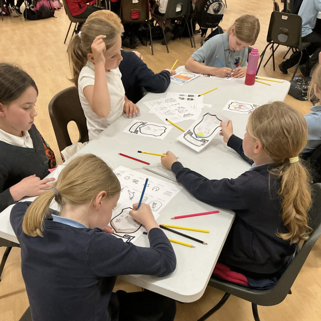 Students sat at a table drawing